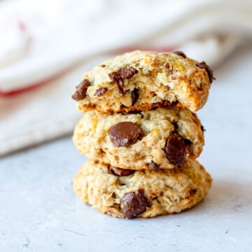 A stack of 3 Banana Oatmeal Cookies sitting on a marble benchtop.